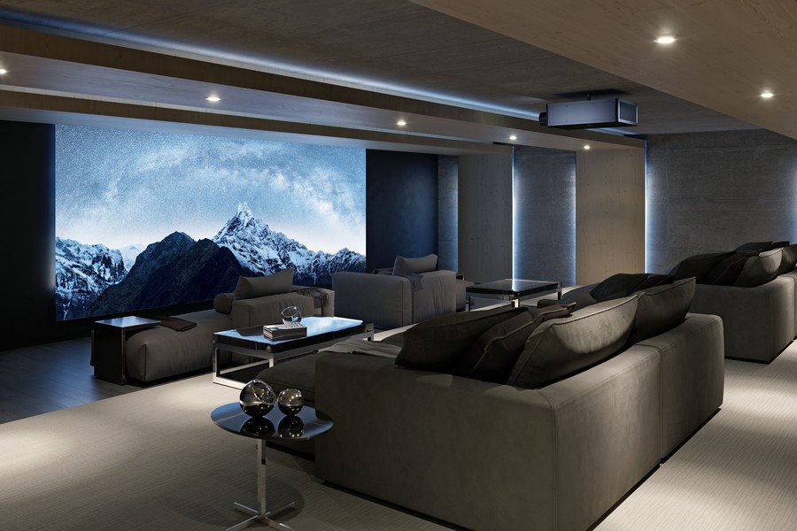A luxury home theater with a mountain view on screen.